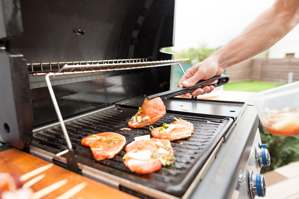 Hand,Of,Young,Man,Grilling,Some,Meat,And,Vegetable meat,Skewers